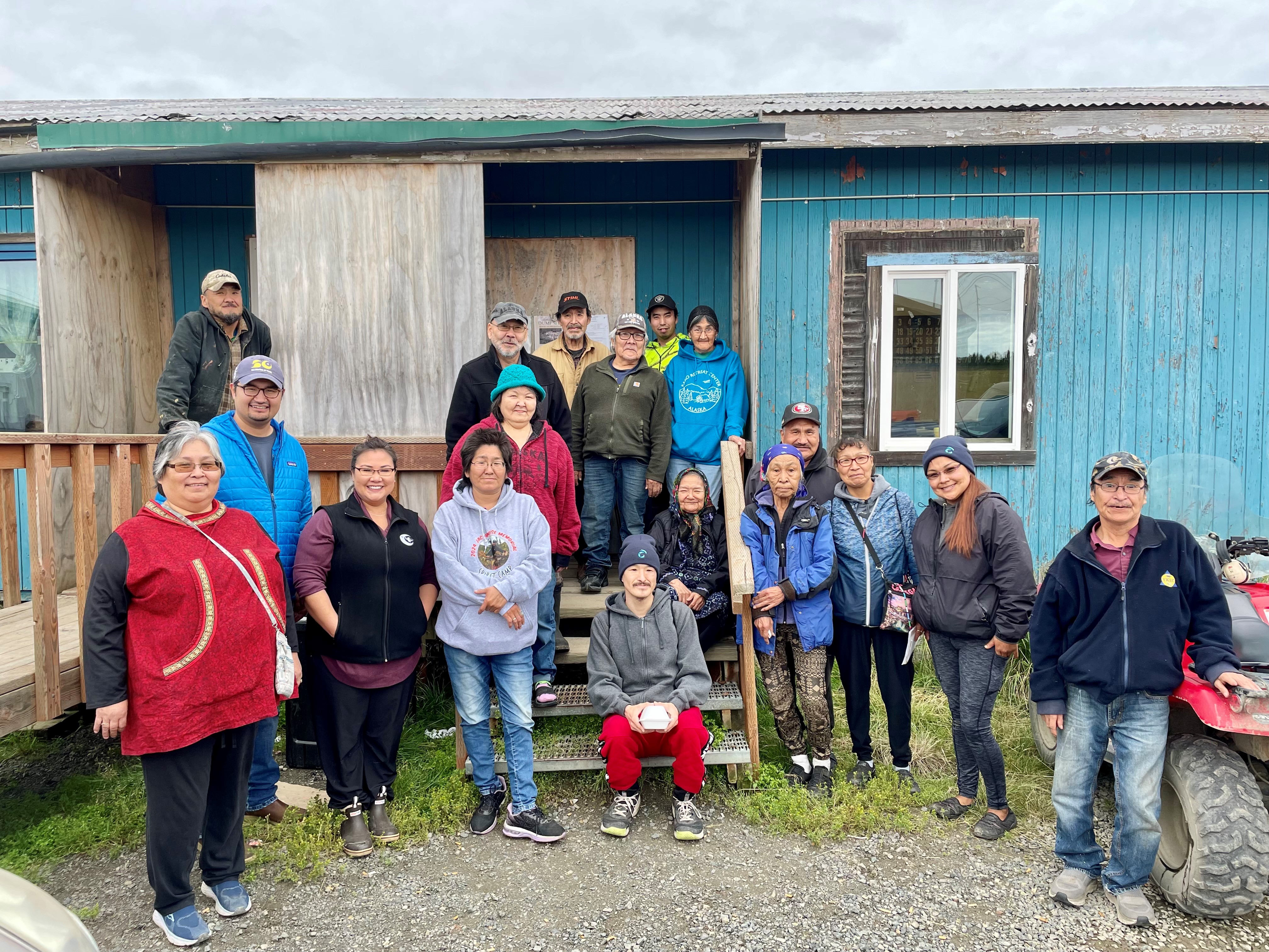 Group in front of blue building
